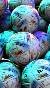 vintage FIFA World Cup trophy surrounded by historical football memorabilia and old photographs